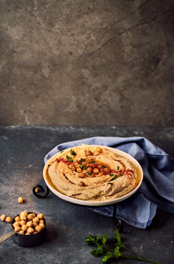 Hummus in a plate on a table